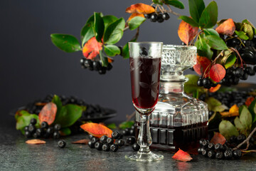 Black chokeberry liqueur and fresh berries.