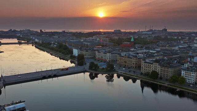 Aerial drone view of Dronning Louises Bridge crossing The Lakes at sunrise in Copenhagen, Denmark