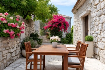 Naklejka premium Mediterranean stone patio with bougainvillea and flowers