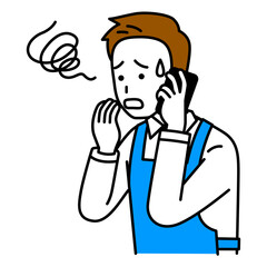 スマートフォンでの通話で困惑するエプロン姿の男性