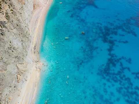Aerial view of the stunning Porto Katsiki beach where the white cliffs meet the turquoise Ionian sea, Lefkada, Greece.