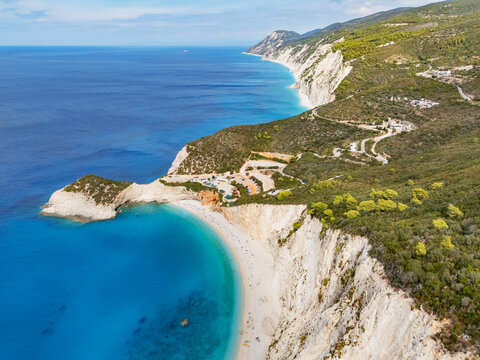 Aerial view of the striking contrast between the turquoise waters and the towering white cliffs of Porto Katsiki beach, Lefkada, Lefkada, Greece.