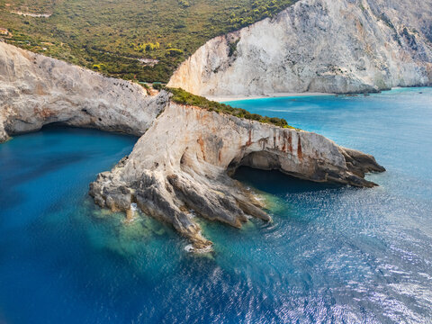 Aerial view of the dramatic white cliffs plunging into the turquoise Ionian Sea at Porto Katsiki beach, Lefkada, Lefkada, Greece.