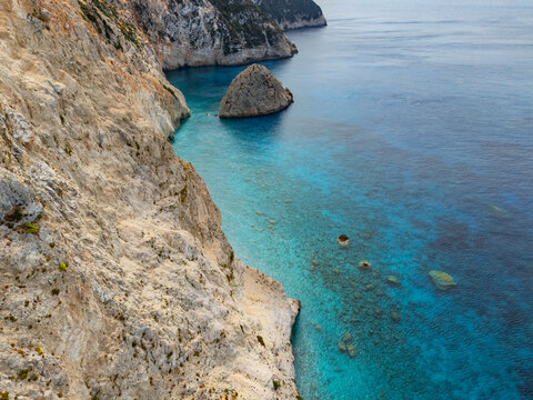 Aerial view of the dramatic cliffs meet the turquoise waters, showcasing the rugged beauty of Porto Katsiki beach, Lefkada, Lefkada, Greece.