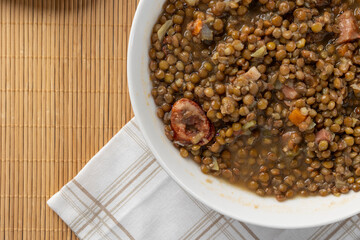 Lentil stew with sausage and vegetables, top view
