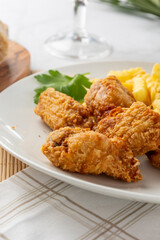 Fried chicken wings and french fries meal