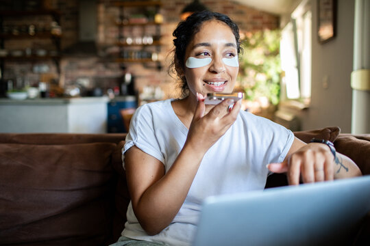 Woman using smartphone at home