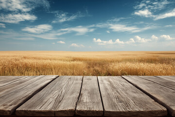 Wooden tabletop with golden wheat field background
