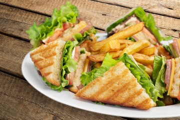 Tasty fresh club sandwich on plate