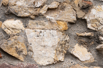Rough stone wall texture with mortar joints
