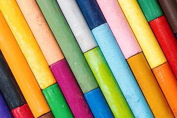 Set of colorful oil pastels for art and drawing, close-up macro shot. Creative tools for artists and students, vibrant colors, education concept. 