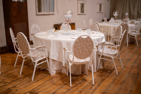 Elegant wedding reception banquet hall with beautifully set tables awaiting guests for a special celebration event