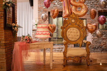 Elegant Birthday Celebration with Number Balloons Cake and Ornate Throne Displaying Sweet Sixteen Festivities