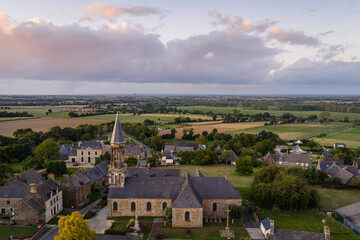 Fototapeta premium Sunset Over Charming French Village Sougeal, Brittany, France