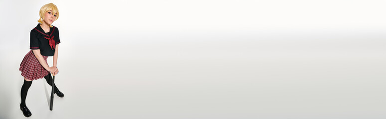 Posing as anime character in school uniform with bat