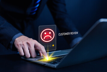 Businessman pressing laptop keyboard with a negative customer review icon showing one-star rating. Concept of bad service, poor feedback, online reputation, customer dissatisfaction, digital marketing
