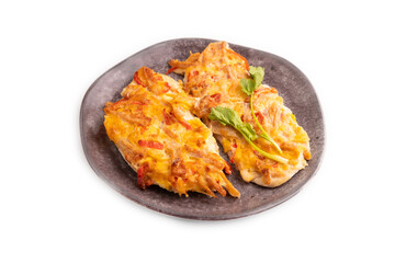 baked chicken meat with cheese and tomatoes isolated on white. side view, close up
