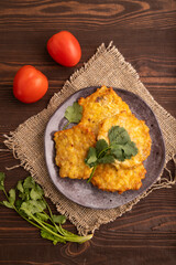 Fried crispy Chicken pancakes on brown wooden. top view, flat lay