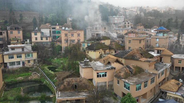 Drone shot of changing developing villages in traditional communities in rice paddy fields of Yuanyang, China