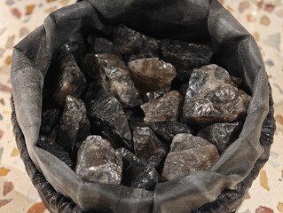 many black aroma stones close up