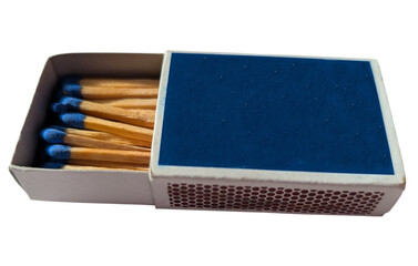 Open box of wooden matches with blue heads on a white background. Everyday household item for lighting candles, fireplaces, or campfires.