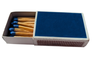 Open box of wooden matches with blue heads on a white background. Everyday household item for lighting candles, fireplaces, or campfires.