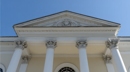 Obraz premium monumental. Classical architectural doorway with elegant columns under a clear blue sky, embodying timeless sophistication. real-estate listings. 