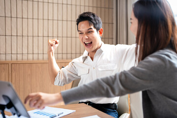 Celebrate and victory to business success with colleagues, celebration  with co-worker partner ,...