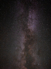 Milky way stars and constellations with a galaxy background photographed from a dark countryside location.