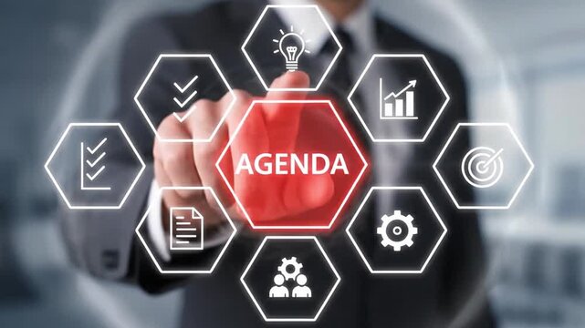 Businessman setting the agenda for a corporate meeting or strategic planning session on a futuristic virtual interface with business icons.