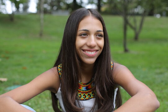 Beautiful Native American gilr smiling in natural setting 