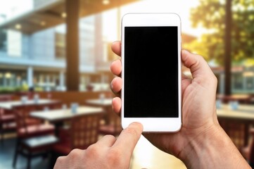 Man hand holding mobile phone with a blank screen