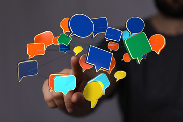 Conceptual abstract network communication with speech bubbles for social media interaction. Man with connecting conversation balloons.