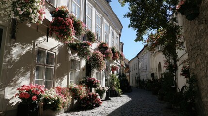 Charming cobbled street with flower adorned facades in a quaint village setting