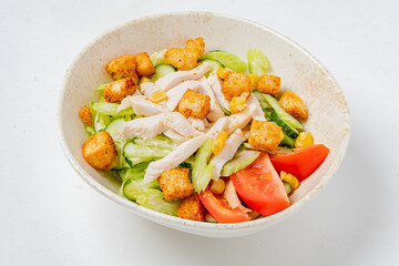 Fresh romaine lettuce topped with grilled chicken, tomatoes, corn, and crispy croutons