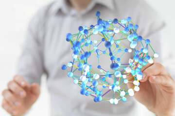 A person's hand gently holds a network sphere, representing data science, technology, and global connections. This image conveys concepts of con
