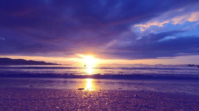 Sea ​​surf waves. Sunset on the tropical seashore. The perfect vacation.