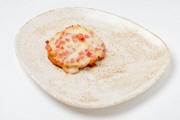 A warm biscuit with melted cheese and fresh tomatoes, ideal for comfort food lovers
