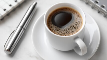 A warm cup of coffee rests on a clean office desk alongside a sleek laptop and an open notebook, creating a serene setting for focused work and creative ideas