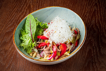 A vibrant mix of fresh greens, peppers, and delicate toppings showcases culinary creativity