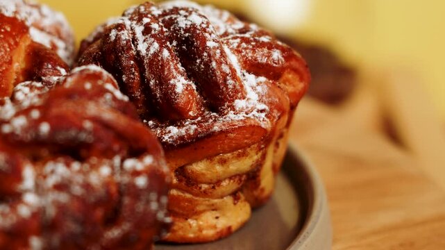 Freshly baked cinnamon rolls in a cozy cafe setting