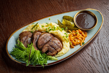 Tender meat with creamy mashed potatoes and colorful veggies make a delicious dish