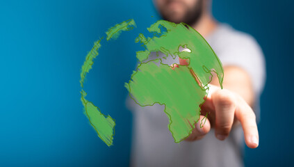 Abstract depiction of a hand interacting with a digital green Earth globe, symbolizing global...