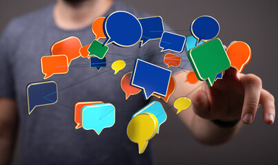 A hand touches speech bubbles, representing networking and digital communication. Modern visual for...