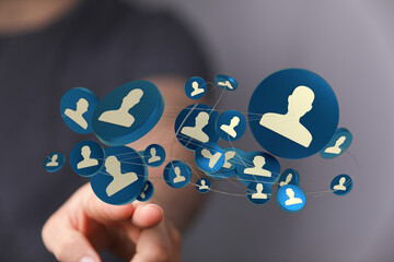 A finger pointing at an illustration of connected people, visualizing network, connection, technology and communication.