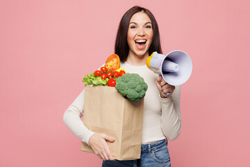 Young woman wear white casual clothes hold bag takeaway mock up with food products scream in...