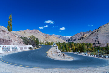  The cars running pass the road on high altitude Ladakh-Leh road in Himalayan mountain of Leh Ladakh, Northern India.