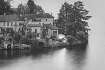 Night view detail of the San Giulio Island, in the middle of Orta Lake (Piedmont, Northern Italy): it is home to a convent of cloistered nuns.