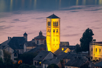 Night view detail of the San Giulio Island, in the middle of Orta Lake (Piedmont, Northern Italy): it is home to a convent of cloistered nuns.