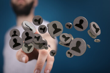 Close-up of a man reaching for digital network user icons. Demonstrates connection, social media,...